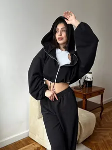 Detailed look at a stylish women's black cropped zip-up hoodie and jogger sweatuit set