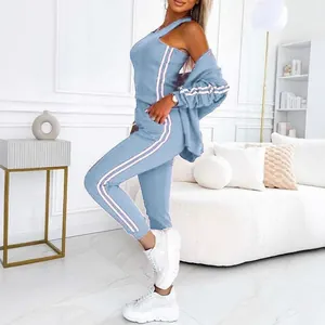Detailed side view of a light blue two-piece sports set featuring stylish pink stripes