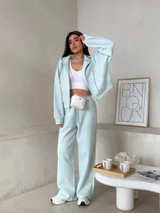 Women's light green cotton tracksuit featuring zip-up hoodie and drawstring pants set