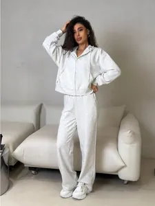 Light grey two-piece cotton tracksuit featuring a zip-up hoodie and drawstring wide-leg pants