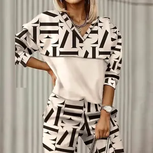 Detailed view of women's two-piece set featuring stylish geometric print and V-neck top