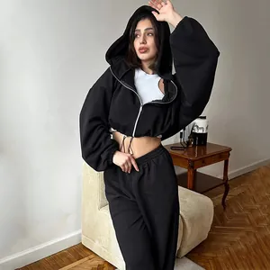 Women's two-piece black tracksuit with cropped zip-up hoodie and joggers