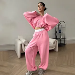 Women's pink casual two-piece tracksuit set with zip-up cropped hoodie and wide-leg pants