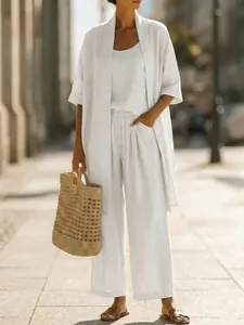 Elegant 3-piece white linen vacation set featuring wide-leg pants and long cardigan