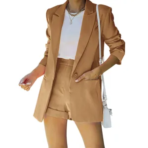Elegant tan women's two-piece suit featuring a lapel blazer and matching shorts set