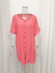 Detailed front view of a pink loose short-sleeved tunic shirt on a transparent mannequin