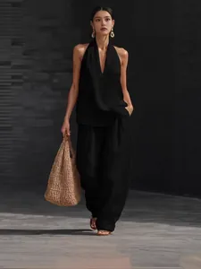 Elegant black French style halter V-neck top and wide-leg pants set for summer wear