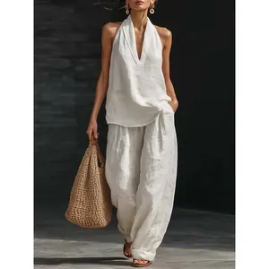 Elegant French chic white linen-style halter V-neck top and wide-leg pants set for women