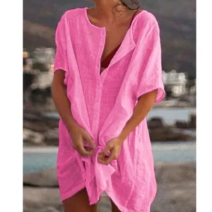Women's bright pink loose-fit short-sleeve shirt cover-up ideal for beach and summer wear