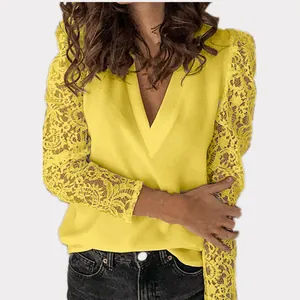 Detail view of yellow slim fit top with intricate lace patchwork sleeves