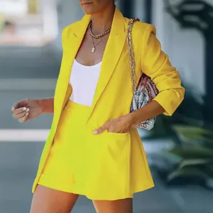 Elegant women's yellow two-piece blazer and shorts set for stylish casual fashion.