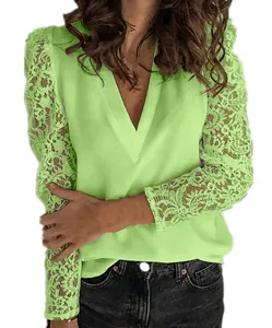 Detailed view of lime green V-neck blouse with intricate floral lace on long sleeves.