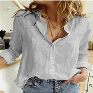 Close-up detail of women's casual loose long-sleeve linen shirt with textured fabric