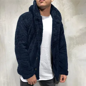 Detail view of men's navy blue hooded fleece jacket with textured teddy fur fabric