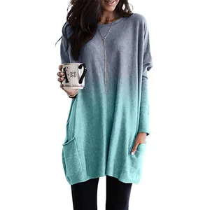 Détail de la tunique ombre à manches longues pour femme avec poches latérales turquoise