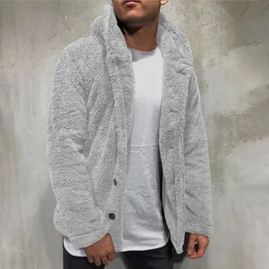 Detail view of a light grey men's hooded fleece jacket showing soft teddy fabric texture