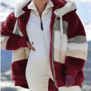 Macro view showing the soft texture of a women's plush color-block hooded jacket