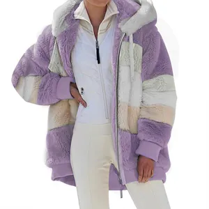 Detail view of women's oversized fuzzy hooded jacket with purple and white color-block.