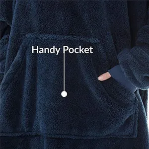 Close-up of the large kangaroo pocket on a navy blue oversized fleece hoodie blanket.