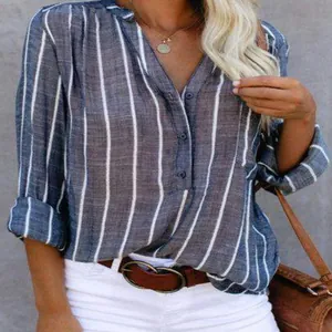 Detail view of a blue and white vertical striped long sleeve shirt with V-neckline