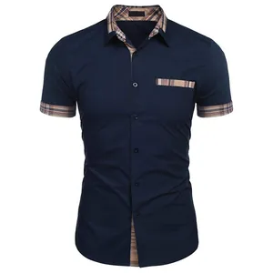 Detail of navy blue men's short-sleeved shirt with plaid accents on collar and cuffs