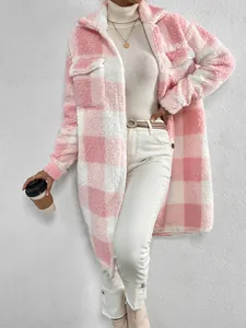 Woman wearing a stylish pink and white checkered long fuzzy coat against a white textured wall