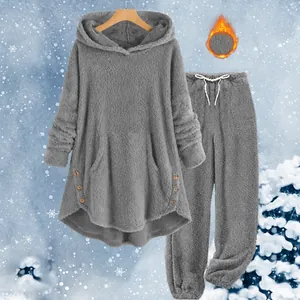 Close-up detail of women's gray cozy fleece hooded sweatshirt and matching pants set