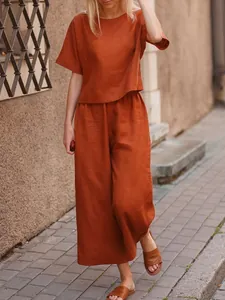 Terracotta linen two-piece set for women featuring loose short sleeve top and wide-leg trousers