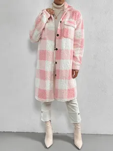 Detailed view of long pink and white checkered plush coat for women with button closure.