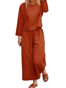 Casual women's rust two-piece set with loose long-sleeve top and wide-leg pants.