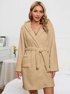 Close-up view of a cozy khaki fuzzy hooded plush bathrobe with a tie-waist belt design