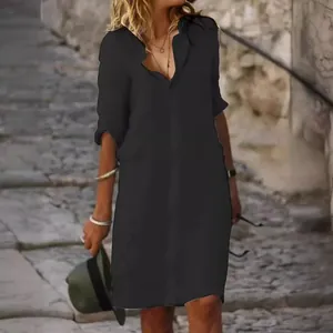Elegant loose fit black cotton linen shirt dress featuring mid-sleeves and a lapel collar