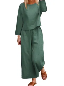 Comfortable loose fit green linen two-piece set with long sleeve top and wide leg pants.