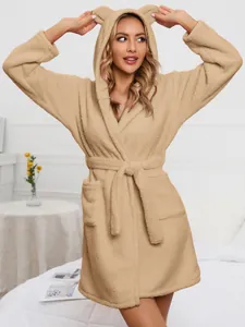 Detail view of beige plush hooded bathrobe featuring adorable animal ears and tie waist