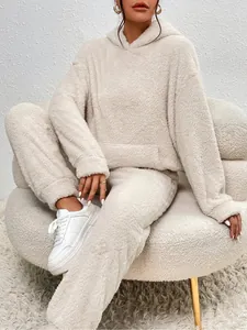 Detail of cozy beige plush two-piece loungewear set featuring a hooded sweatshirt