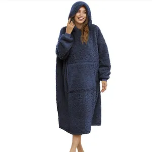 Full length view of a cozy oversized navy blue sherpa wearable blanket hoodie on a model