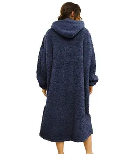 Back view of a long navy blue oversized wearable blanket hoodie made of soft sherpa fleece