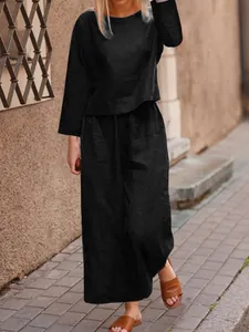 Elegant black two-piece linen set with loose top and wide-leg trousers for women fashion