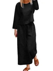 Model wearing a comfortable black loose fit two-piece casual shirt and trousers set
