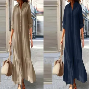 Side-by-side view of khaki and navy linen maxi shirt dresses with button details.