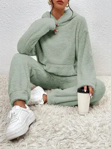 Detailed view showing the plush sherpa fabric of this sage green hooded loungewear set