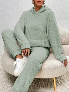 Detail of soft sage green fleece hoodie and matching pants loungewear set for women