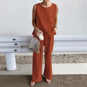 Casual burnt orange two-piece linen set with sleeveless top and wide-leg trousers
