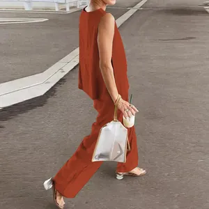 Elegant side view of a women's casual two-piece set with sleeveless top and wide trousers
