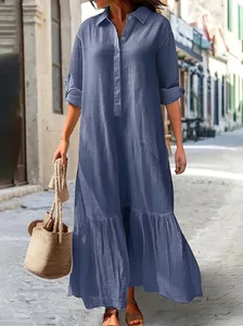 Elegant relaxed blue cotton linen maxi dress featuring a shirt collar and tiered hem
