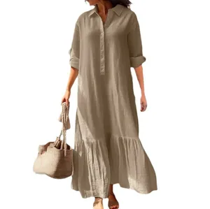 Elegant khaki cotton linen maxi dress with shirt collar and ruffle hem for a relaxed summer look.