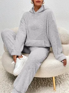 Cozy light grey fleece loungewear set featuring a hooded sweatshirt and matching pants.