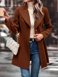 Detailed view of women's brown wool coat with lapel collar and slim-fit design
