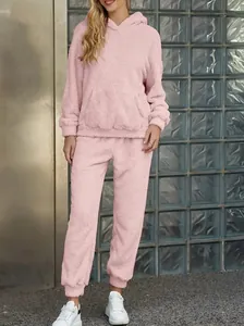 Full view of a cozy pink fleece hoodie and matching pants lounge set for autumn