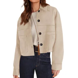 Detail view of stylish beige short suede jacket for women, casual autumn outerwear.